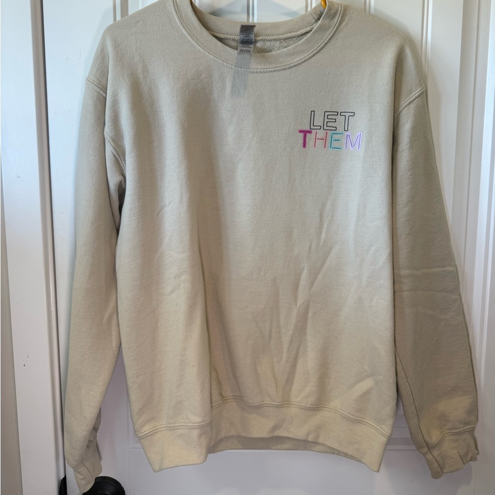 Beige crewnecks with “Let them” graphic